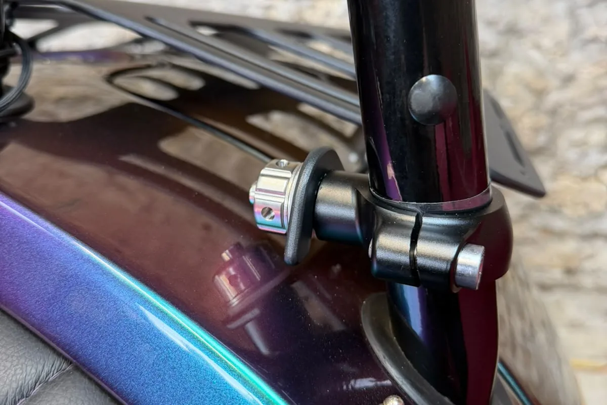 An anodised 6082 T6 aluminium clamp securing the luggage rack to the roll hoop of a Morgan 3 Wheeler