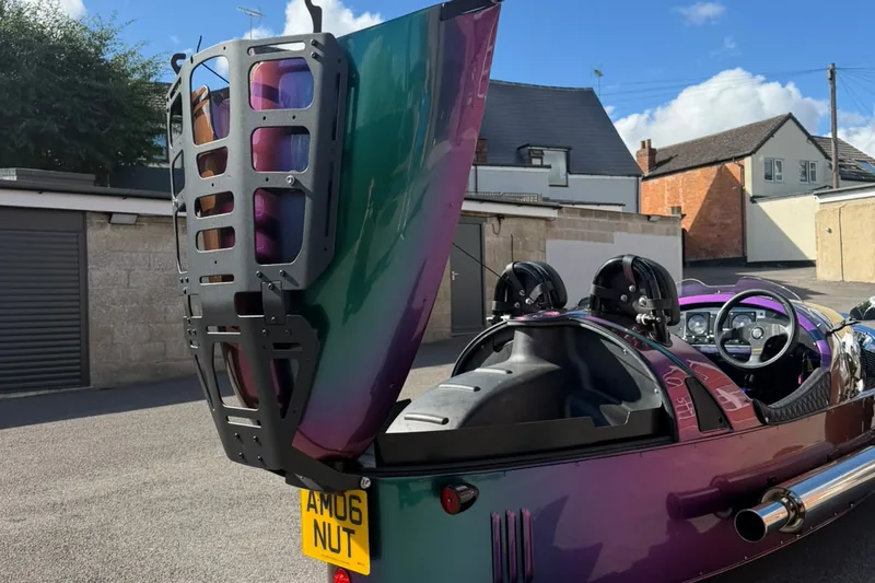 The boot lid raised with the rack fitted, seen from the rear
