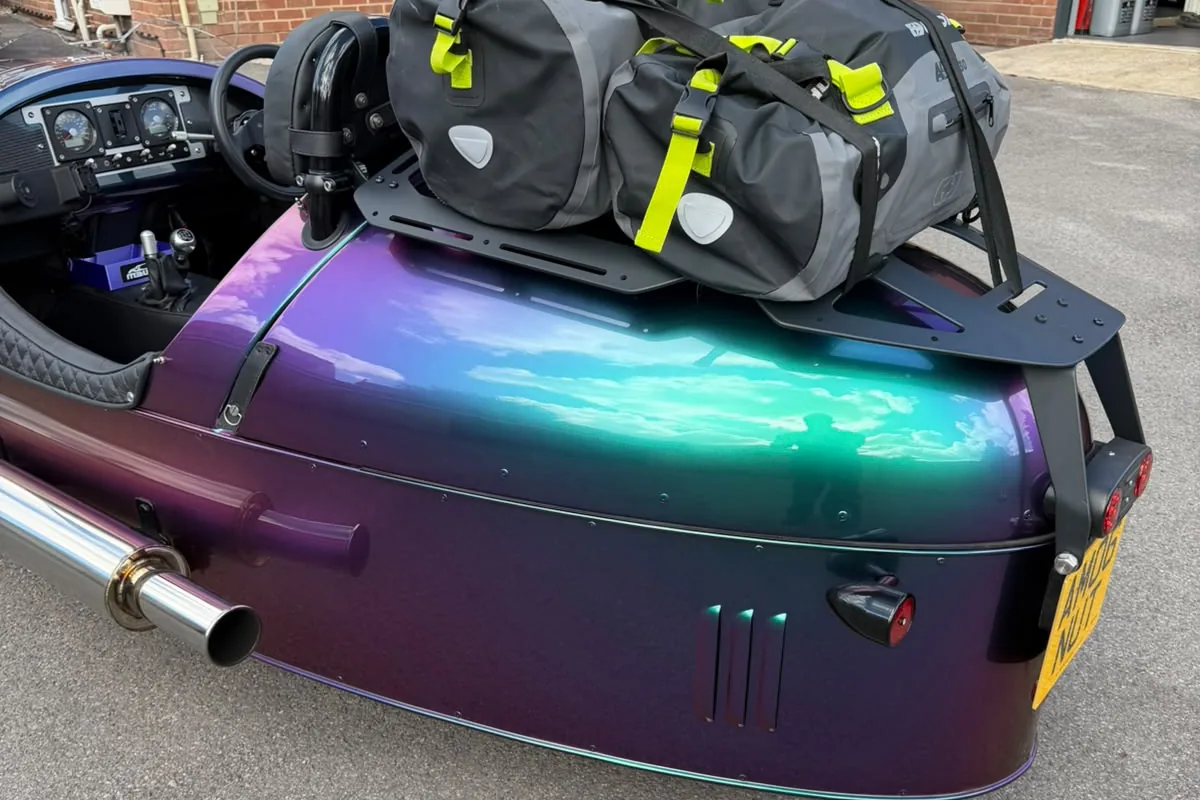 The M3W luggage rack loaded with a drybag on the rear deck of a Morgan 3 Wheeler